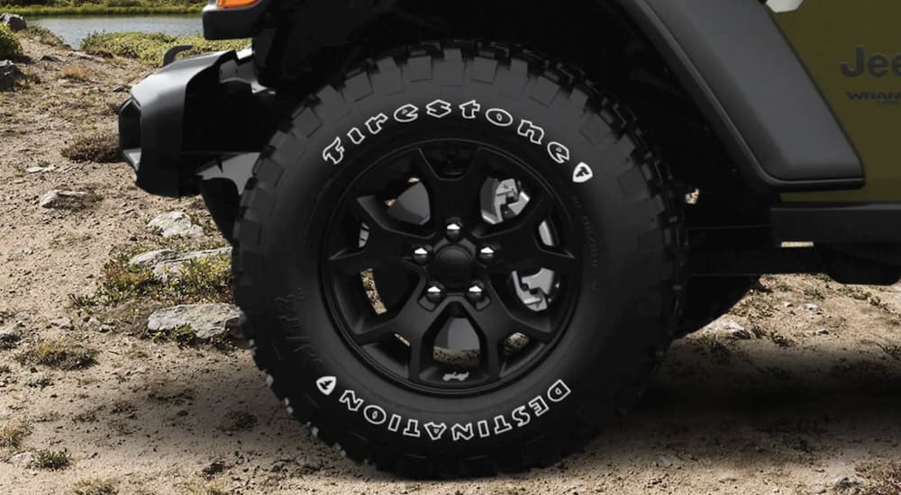 A black tire is shown on a 2021 Jeep Wrangler Willy.