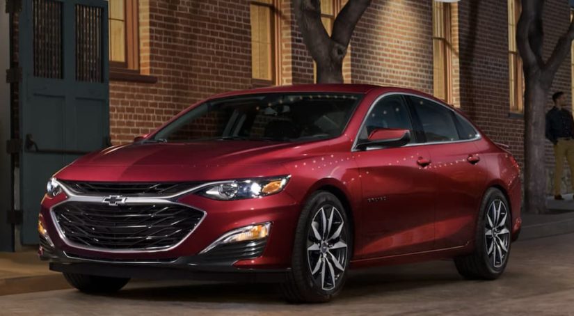 A red 2022 Chevy Malibu is shown from the front.