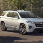 A silver 2022 Chevy Traverse Premier is shown parked in a driveway.