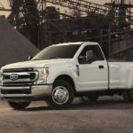 A white 2022 Ford F-350 is shown from the side parked at a construction site after winning a 2022 Ford F-350 vs 2022 GMC Sierra 3500HD comparison.