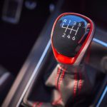 A close up shows the manual shift knob in a 2022 Volkswagen Golf GTI.