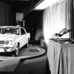 A white 1964 Ford Mustang is shown at the World's Fair.