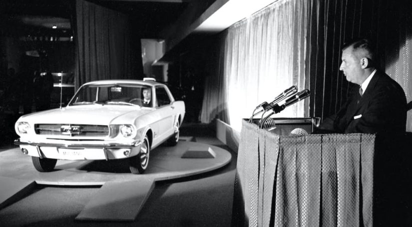A white 1964 Ford Mustang is shown at the World's Fair.