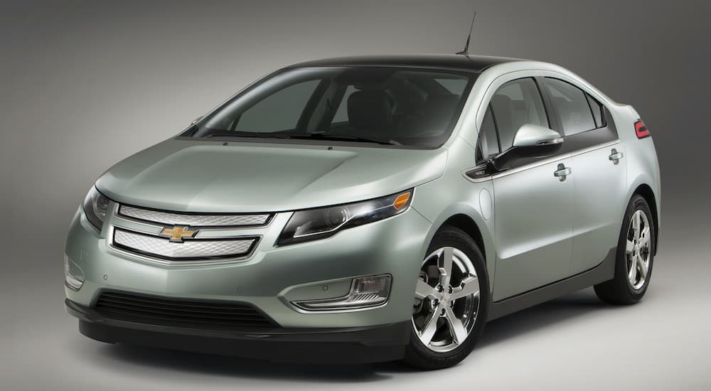 A silver 2011 Chevy Volt is shown from the front angled left.