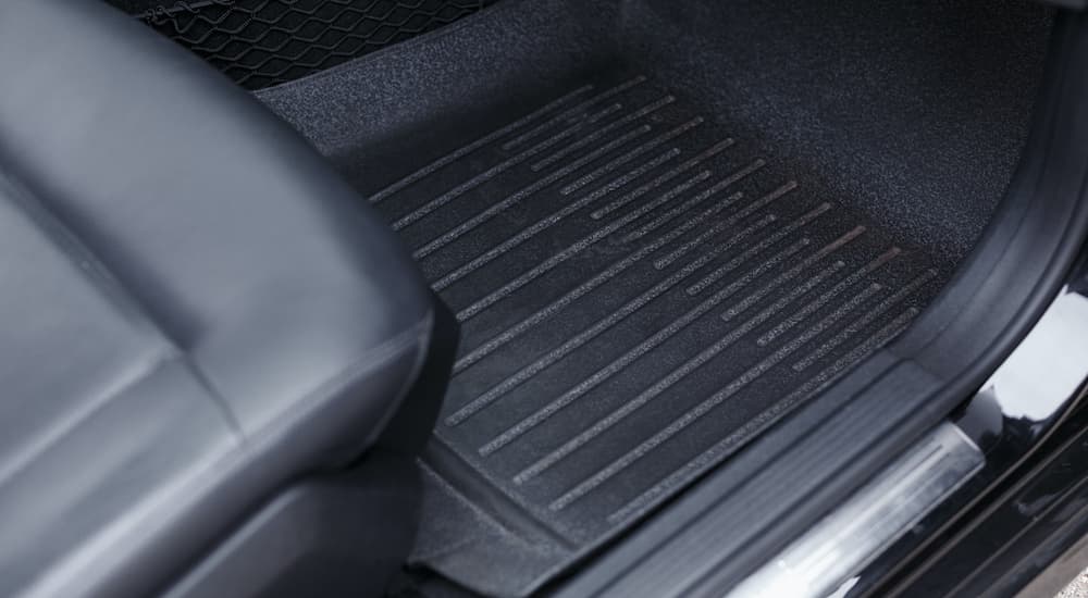A floor mat is shown in close up at a winter tire dealer.