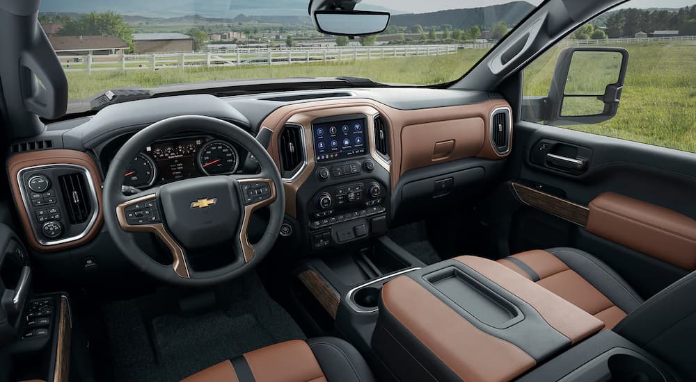 The front interior and dash are shown in a 2022 Chevy Silverado 3500 HD.