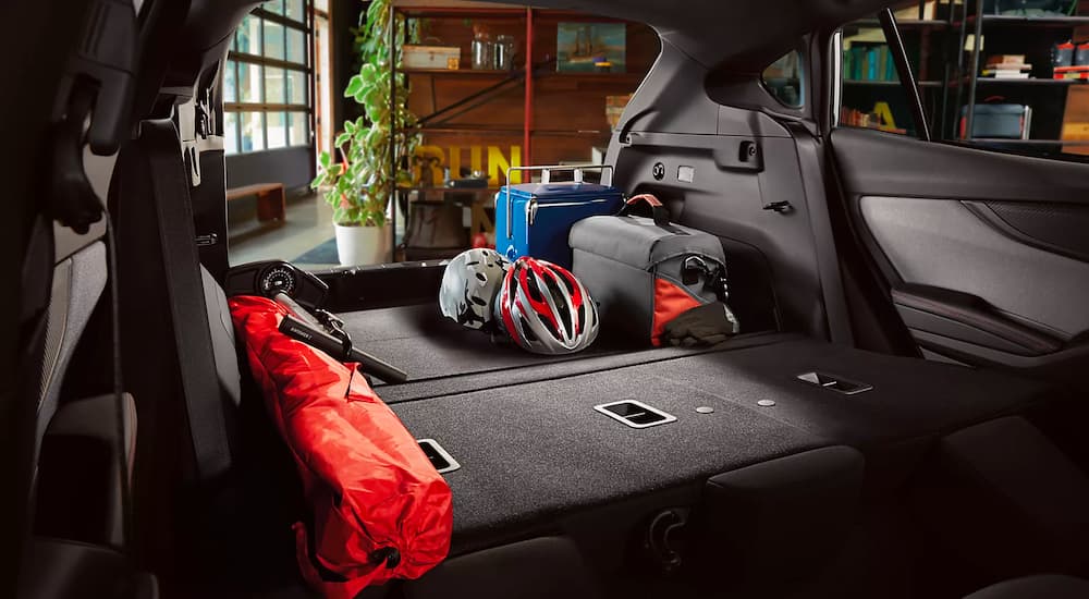 Biking cargo is shown in the trunk of a 2023 Subaru Impreza.