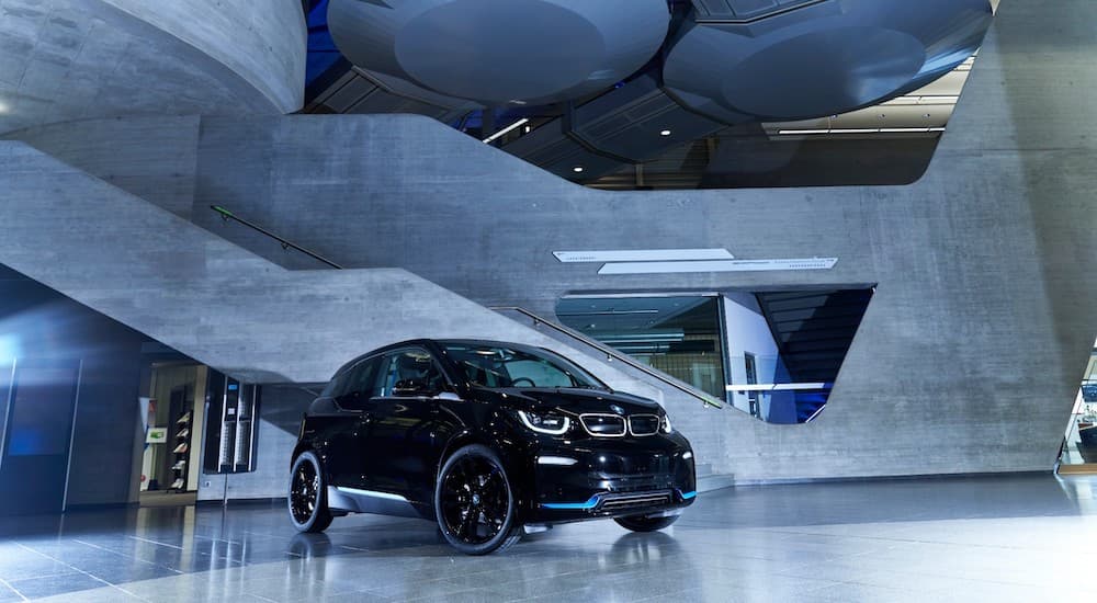 A black 2021 BMW i3 is shown parked in a lobby.
