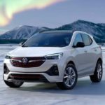 A white 2023 Buick Encore GX is shown parked on snow after leaving a Buick dealer.