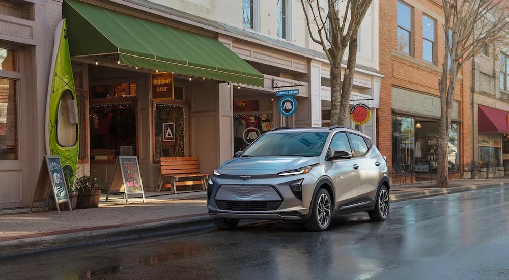A silver 2022 Chevy Bolt EUV is shown parked on a city street by a Chevrolet dealer near you.