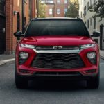 A red 2022 Chevy Trailblazer RS is shown from the front on a city street.