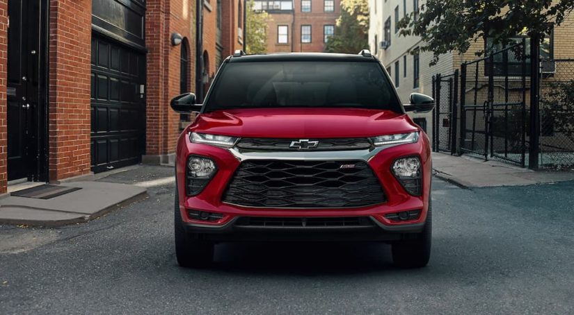 A red 2022 Chevy Trailblazer RS is shown from the front on a city street.