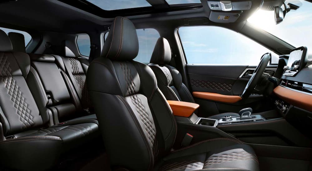 The black leather interior is shown in a 2023 Mitsubishi Outlander PHEV.