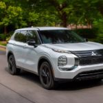 A silver 2023 Mitsubishi Outlander is shown on the way to check out SUVs for sale.