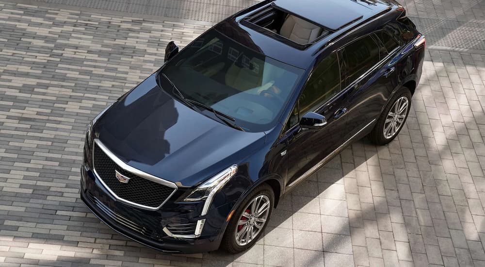 A blue 2022 Cadillac XT5 is shown from a high angle.