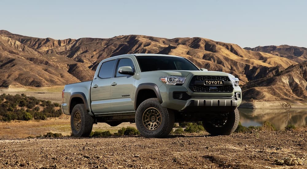A grey 2022 Toyota Tacoma Trail Edition is shown parked in an open desert.