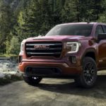 A red 2019 GMC Sierra 1500 Elevation is shown parked next to a river.