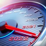 A tachometer is shown in close up with RPMs replaced by years and the needle in redline on 2022.