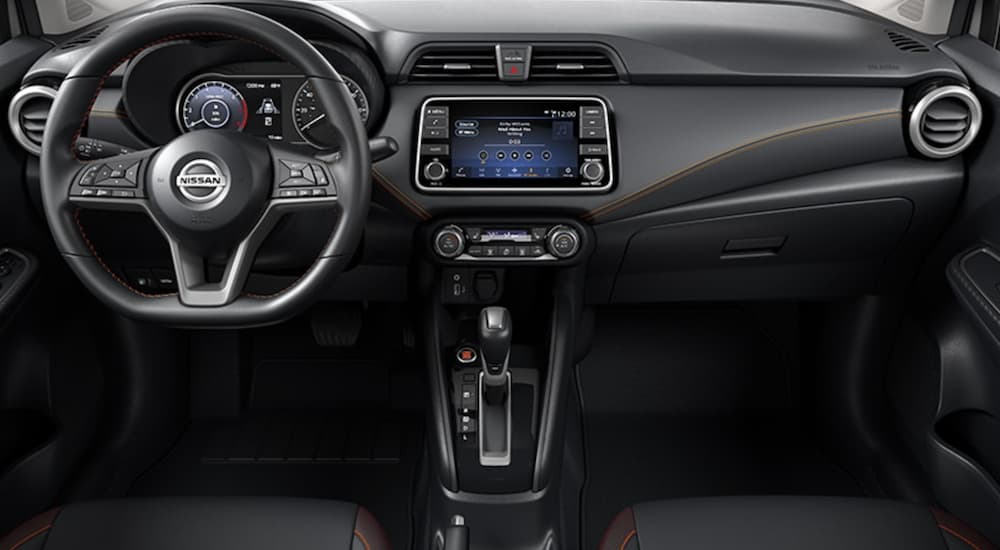 The interior of a 2022 Nissan Versa is shown from above the center console facing forward.