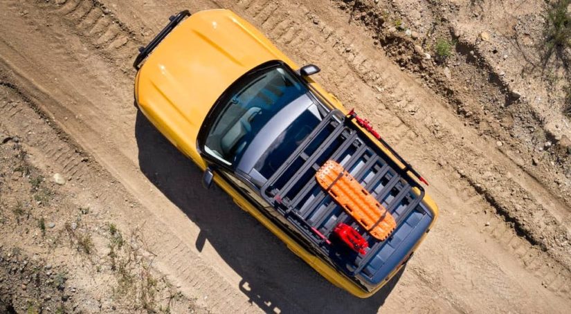 A yellow 2022 Ford Bronco Sport Badlands is shown from an aerial view on a dirt path after winning a off-road showdown between the 2022 Ford Bronco Sport vs 2022 Honda HR-V.
