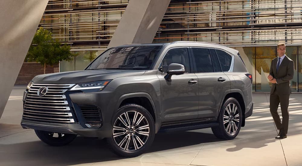 A silver 2022 Lexus LX is shown parked outside of a modern building.
