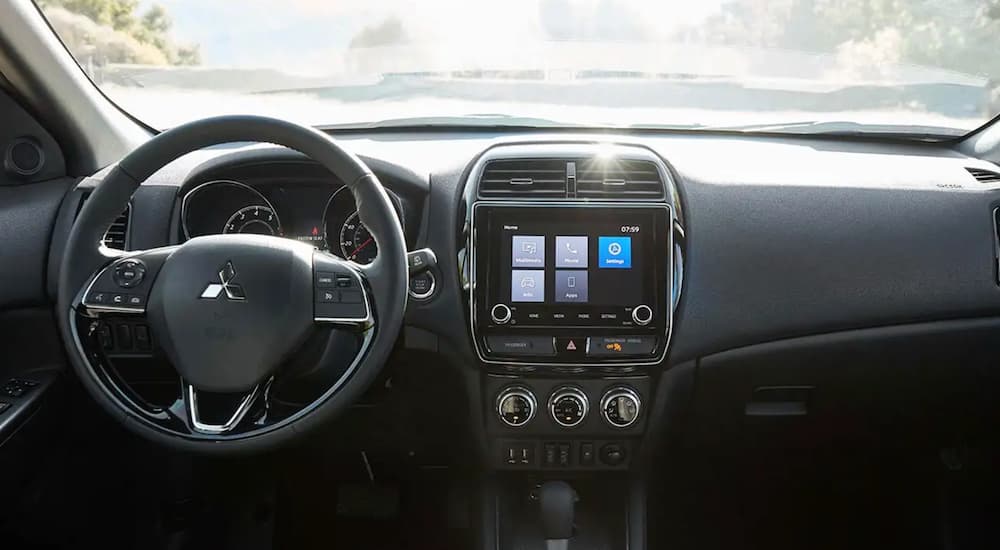 The dash of a 2022 Mitsubishi Outlander is shown from above the center console.