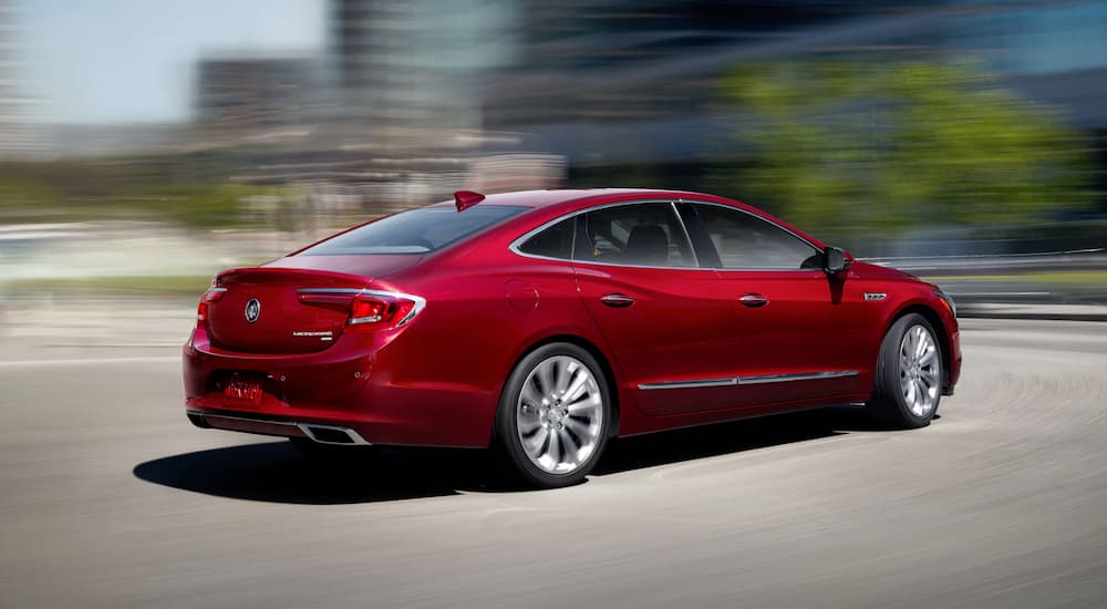A red 2019 Buick LaCrosse is shown speeding down a city street.