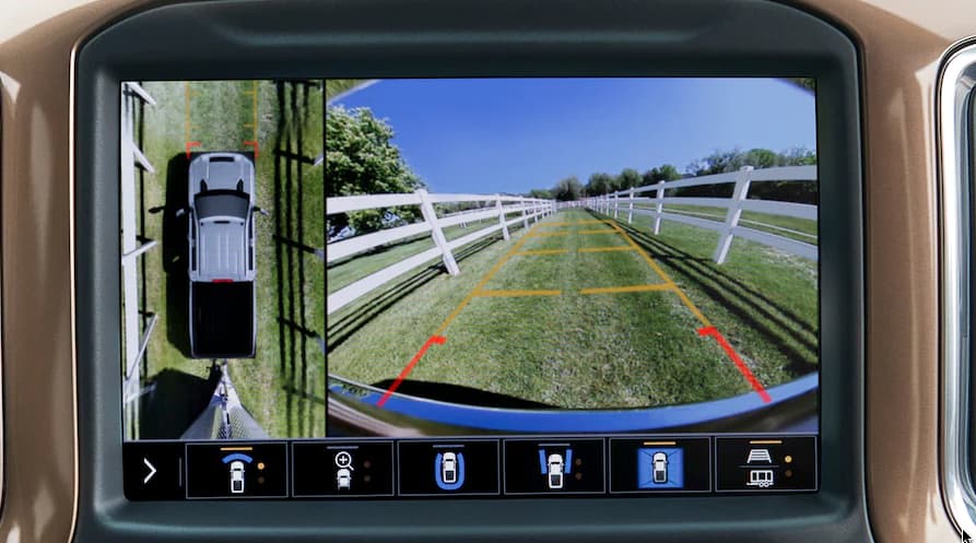 A close up of the dash of a 2021 Chevy Silverado 3500 is shown displaying the backup camera.
