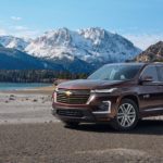 A brown 2022 Chevy Traverse is shown in the mountains during a 2022 Chevy Traverse vs 2022 Ford Explorer comparison.