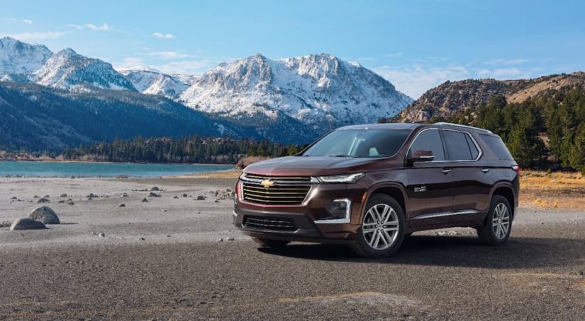 A brown 2022 Chevy Traverse is shown in the mountains during a 2022 Chevy Traverse vs 2022 Ford Explorer comparison.