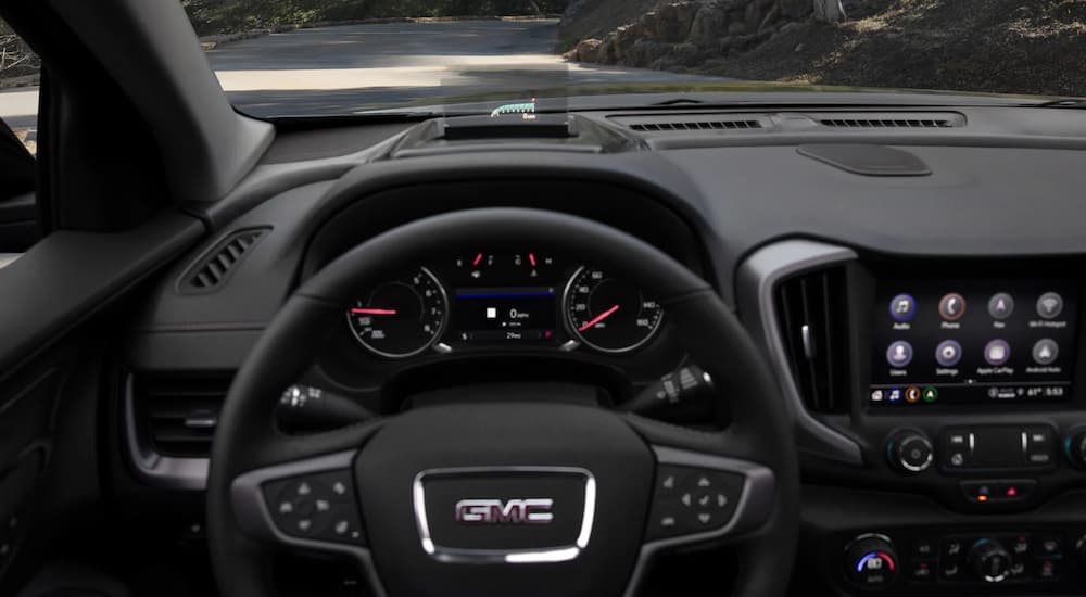 A close up of the steering wheel is shown in a 2022 GMC Terrain AT4.
