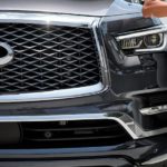 A close up of the grille of a grey 2022 Infiniti QX80 is shown.