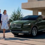 A green 2022 Lincoln Nautilus is shown parked in a driveway.