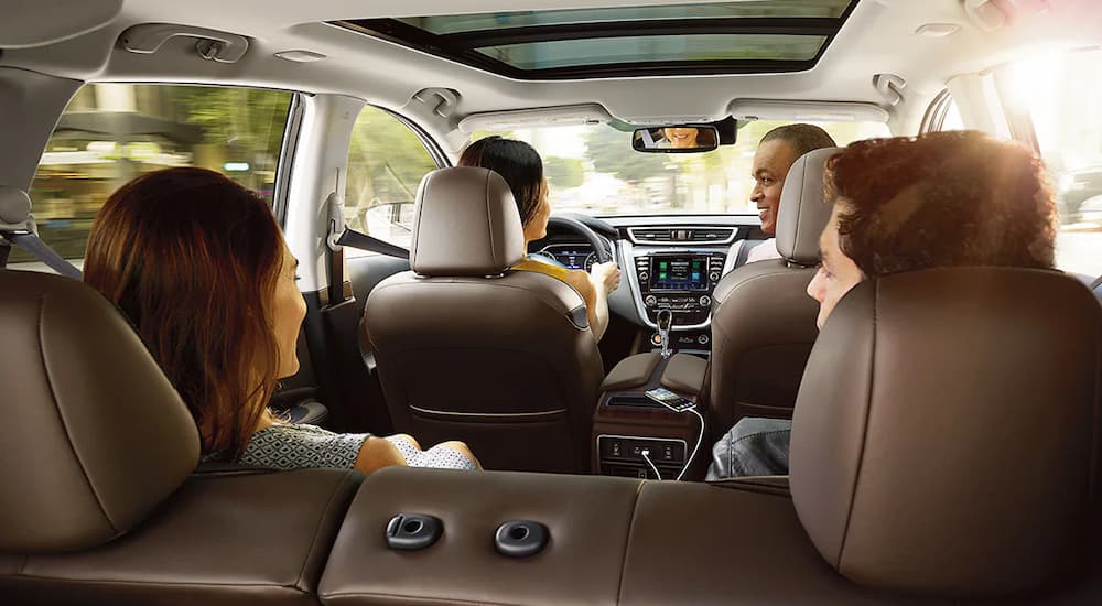 A group of friends are shown going for a drive in a 2022 Nissan Murano.