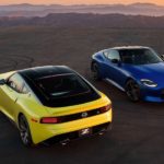 A yellow and a blue 2023 Nissan Z are shown facing opposite directions from a high angle after leaving a Nissan dealer in Minot.