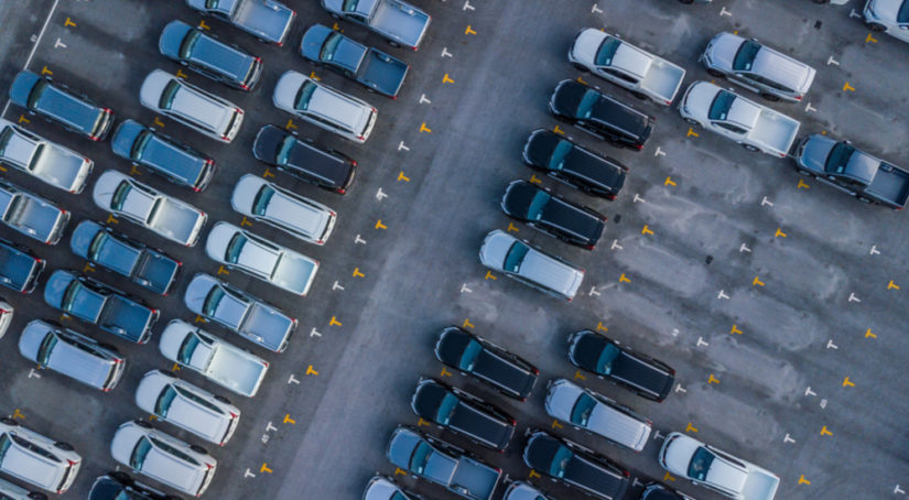 A high view of a certified pre-owned Chevy dealer car lot is shown.