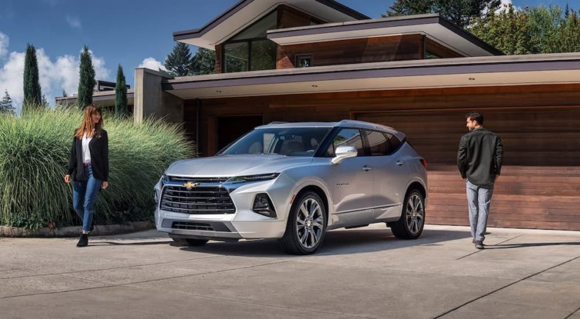 A silver 2021 Chevy Blazer is shown parked in a home driveway.