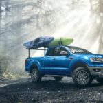 A blue 2022 Ford Ranger Lariat SuperCab is shown parked on a remote trail.