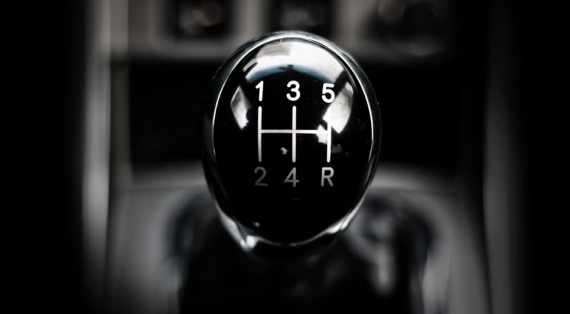 A manual shift knob is shown in a vehicle.