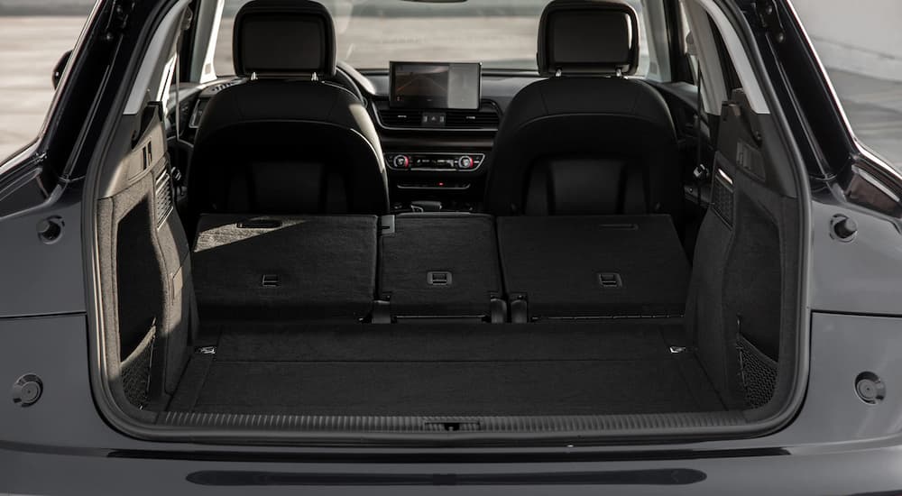The trunk of a black 2022 Audi Q5 is shown open.