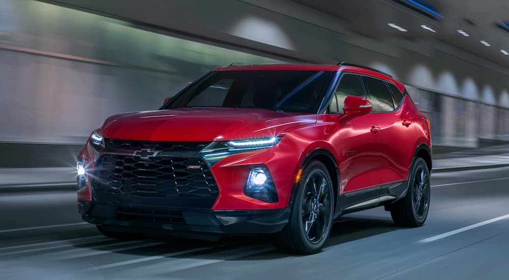 A 2020 Chevy Blazer RS is shown from the front at an angle while driving on a city street.