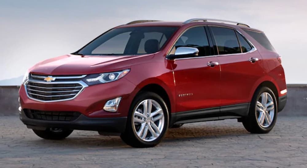 A red 2020 Chevy Equinox is shown from the front at an angle.