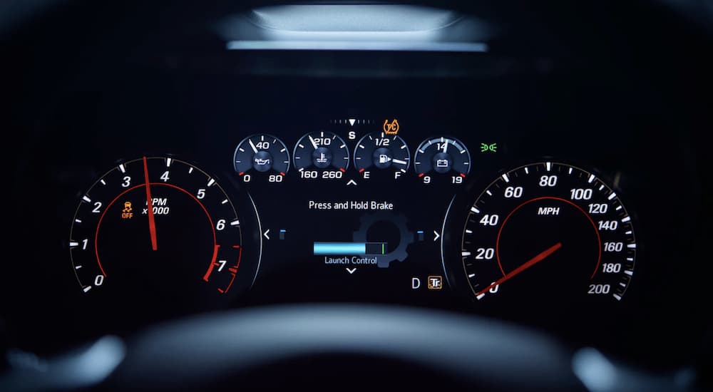 The lit dashboard of a 2022 Chevy Camaro is shown.