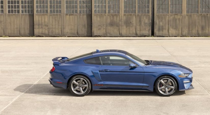 A blue 2022 Ford Mustang GT C/S is shown from the side after leaving a Ford Dealership.