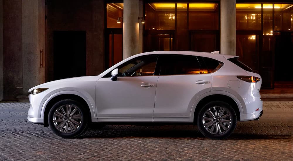 A white 2022 Mazda CX-5 is shown parked from the side.