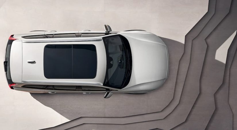 A silver 2022 Volvo V60 Cross Country is shown from a high angle.