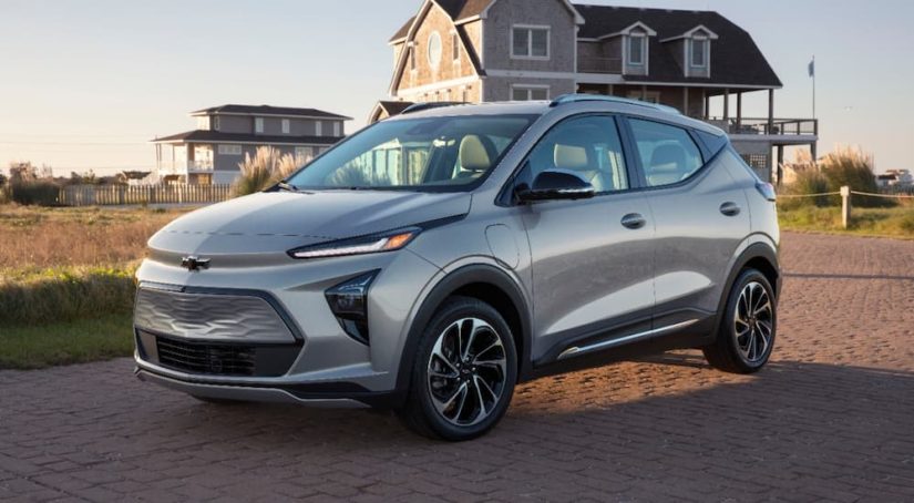 A silver 2022 Chevy Bolt EUV is shown parked in a driveway after leaving a Chevrolet dealer.