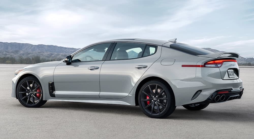 A grey Kia Stinger GT3 is shown from the side.