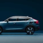 A blue 2022 Volvo C40 Recharge is shown from the side while charging.