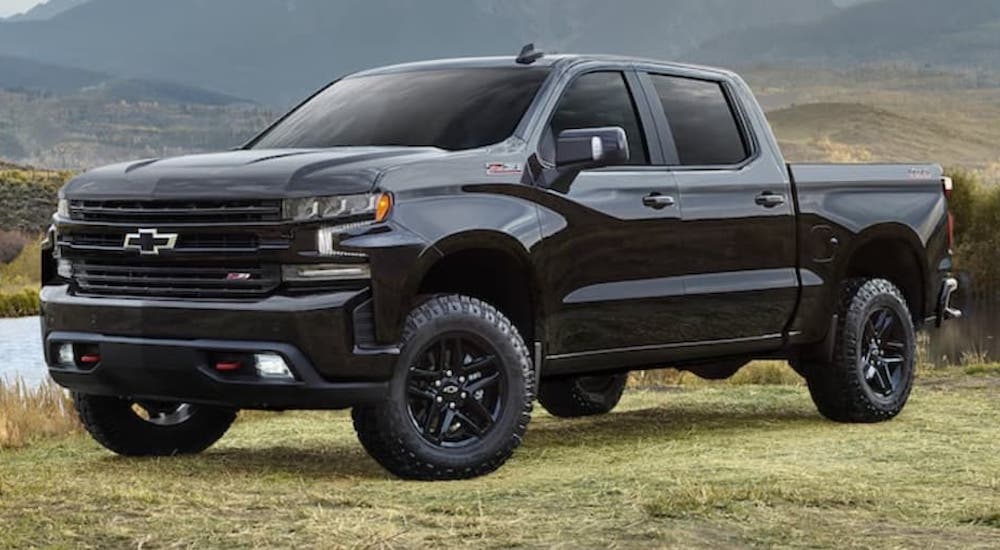 A black 2022 Chevy Silverado Trail Boss is shown from the front at an angle.